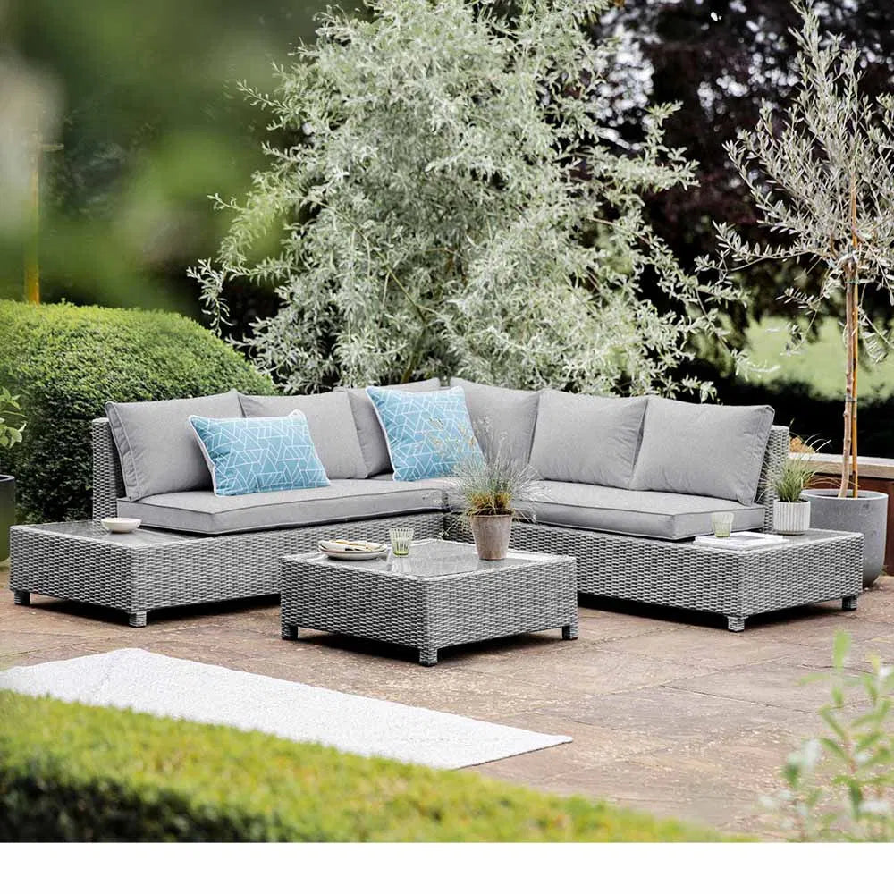 Luxurious outdoor rattan corner sofa set on a sunlit patio