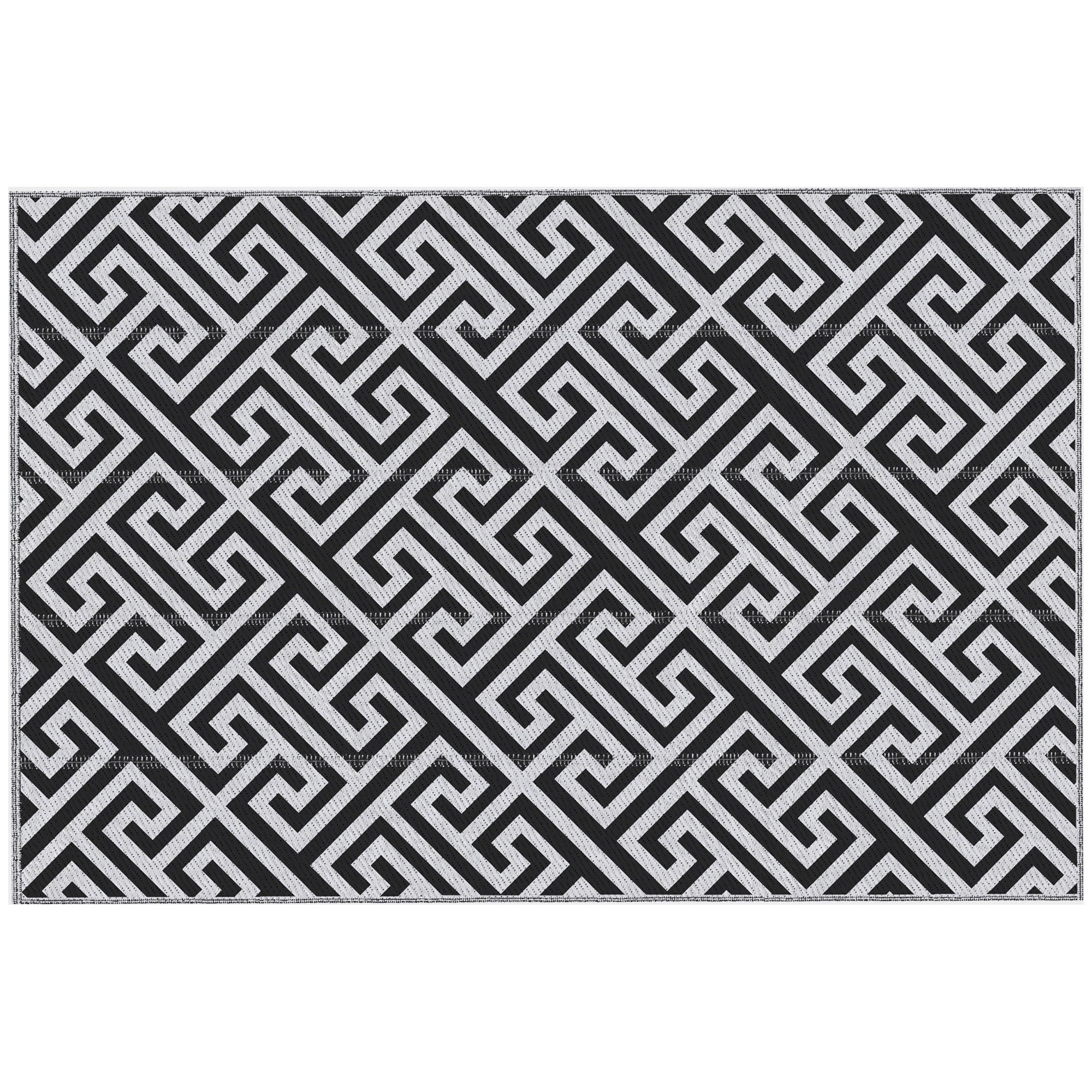 Black and white geometric patterned rug on a white background