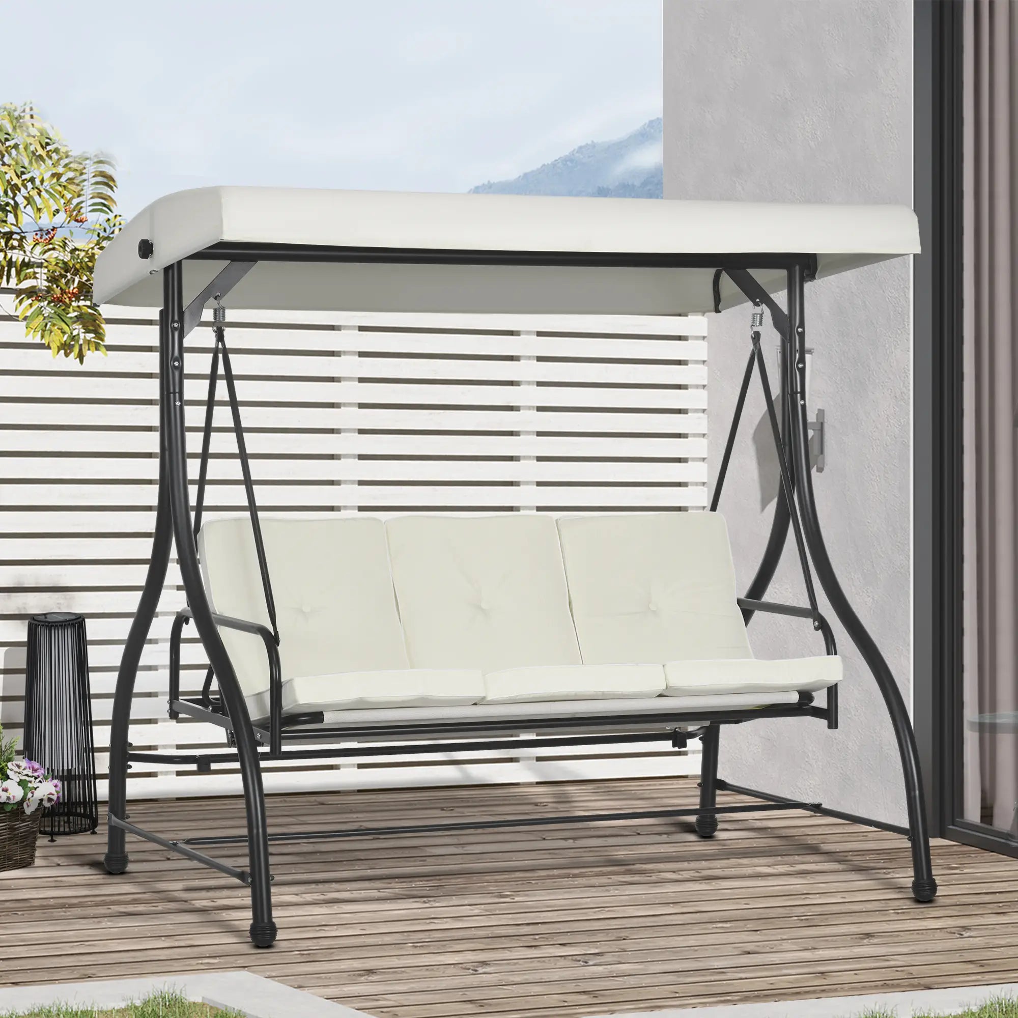 Outdoor swing chair with canopy on a wooden deck
