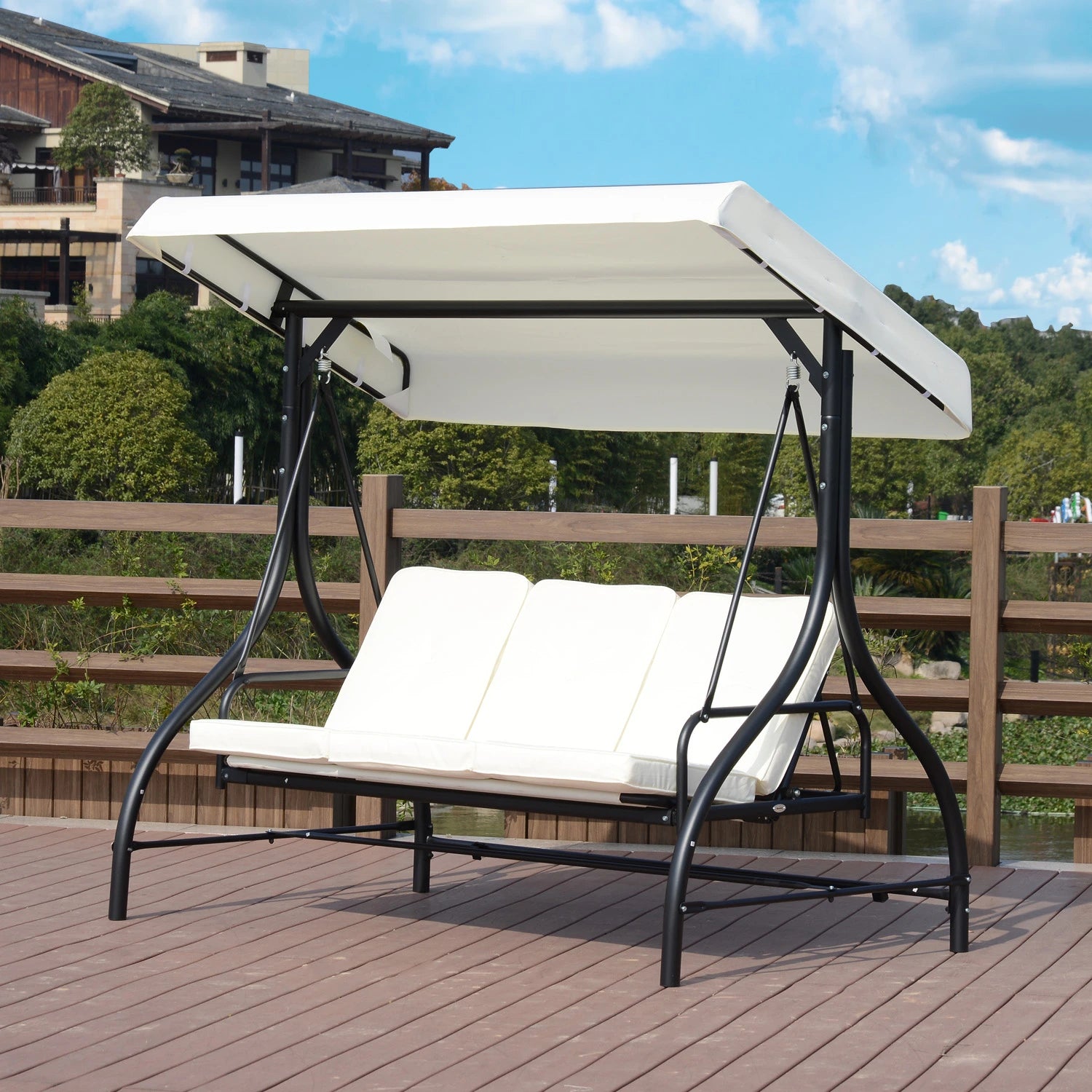 Outdoor swing with canopy on a wooden deck