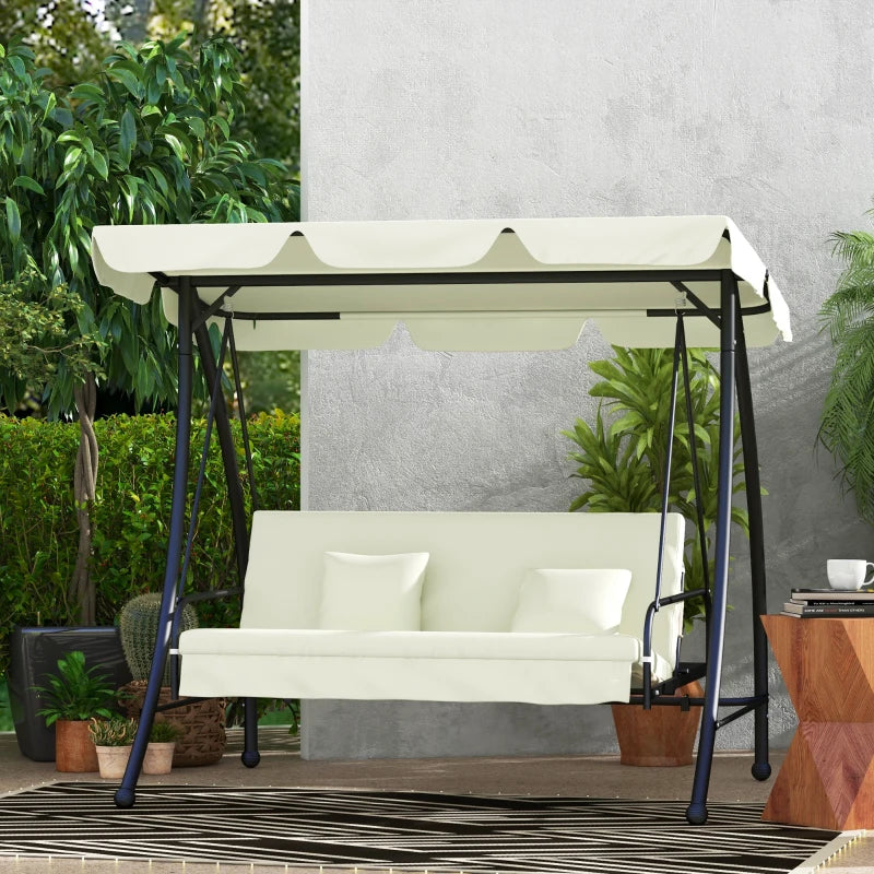 White swing with canopy in a garden setting