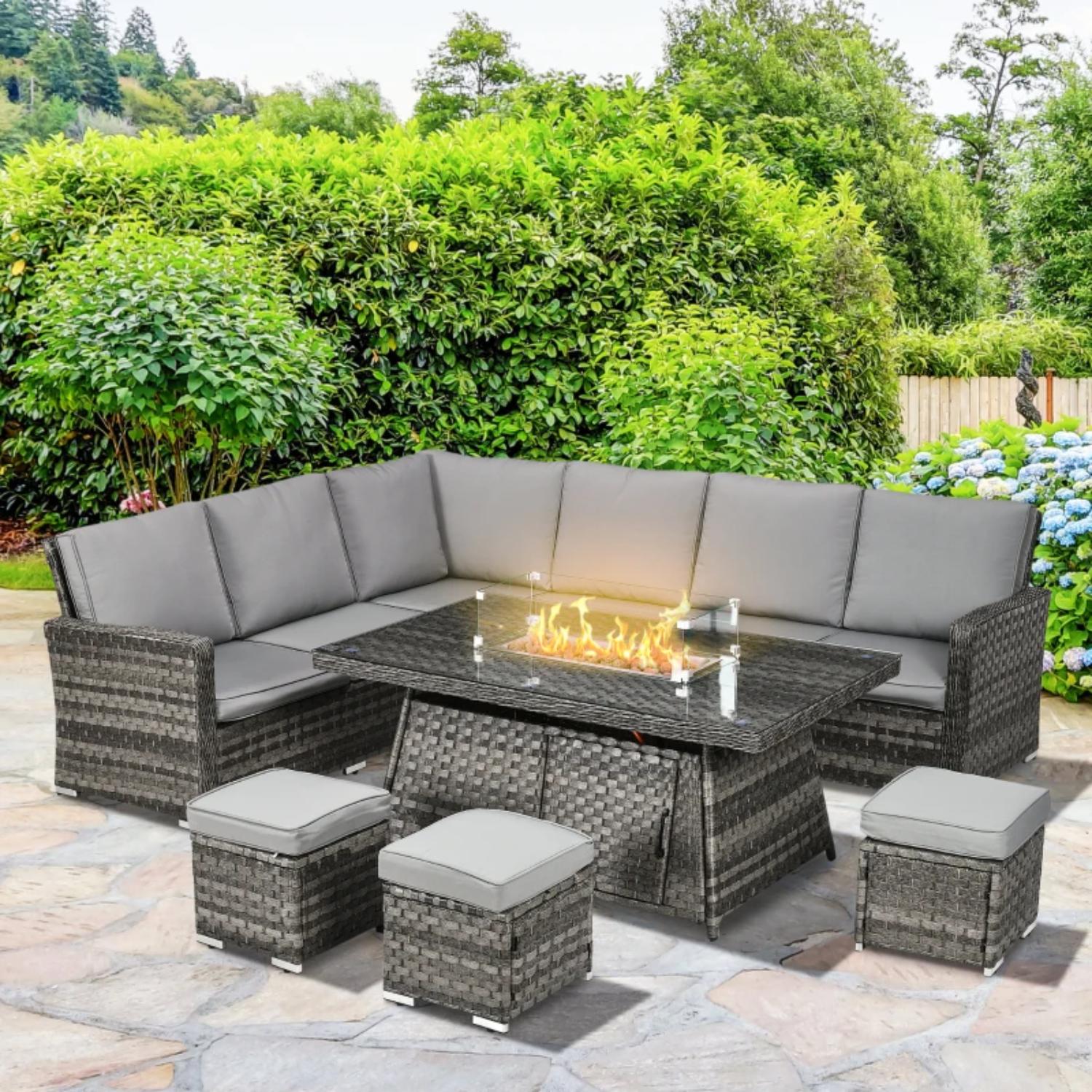 Outdoor patio set with fire pit table in a garden setting