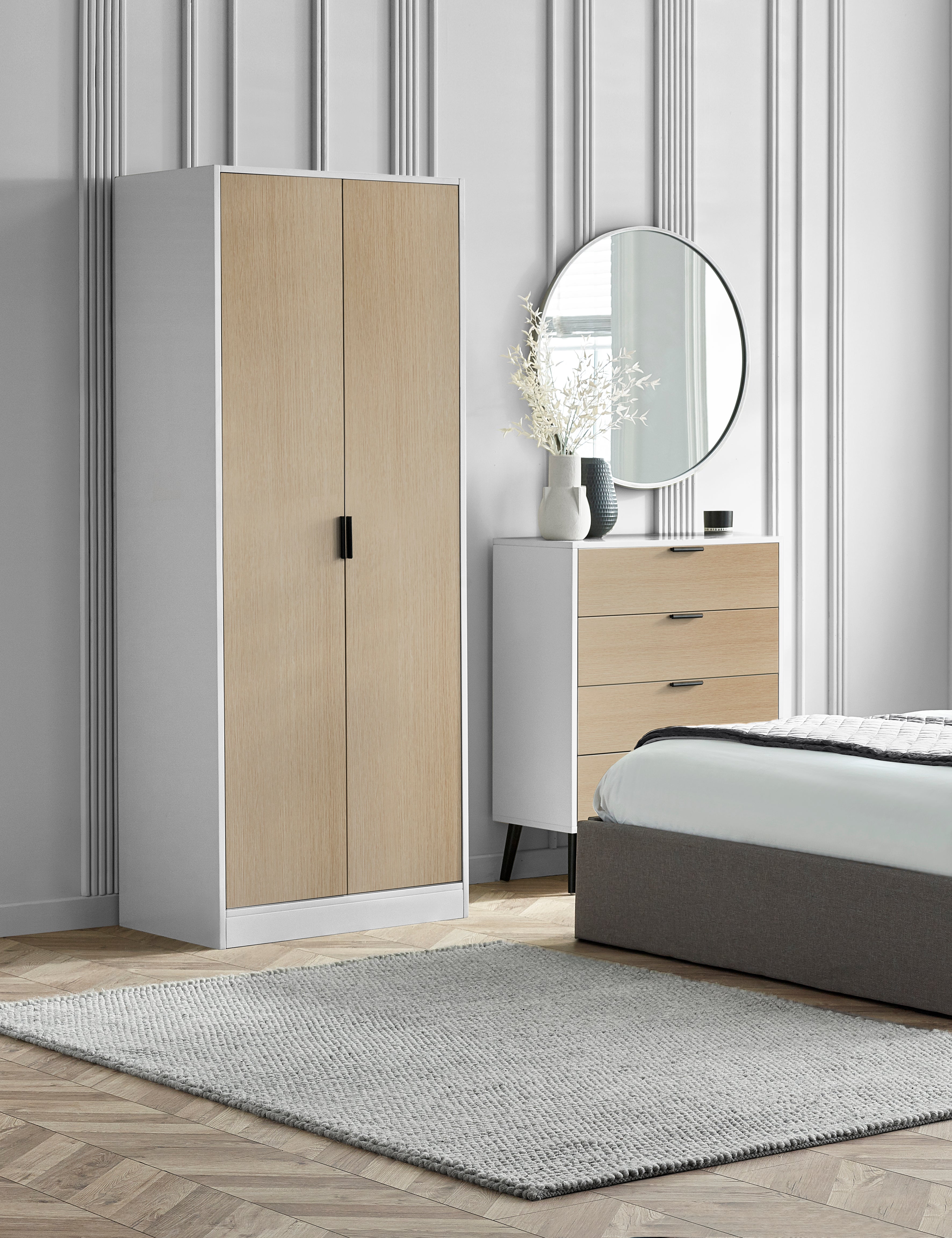 Modern bedroom with a wardrobe, dresser, and bed.