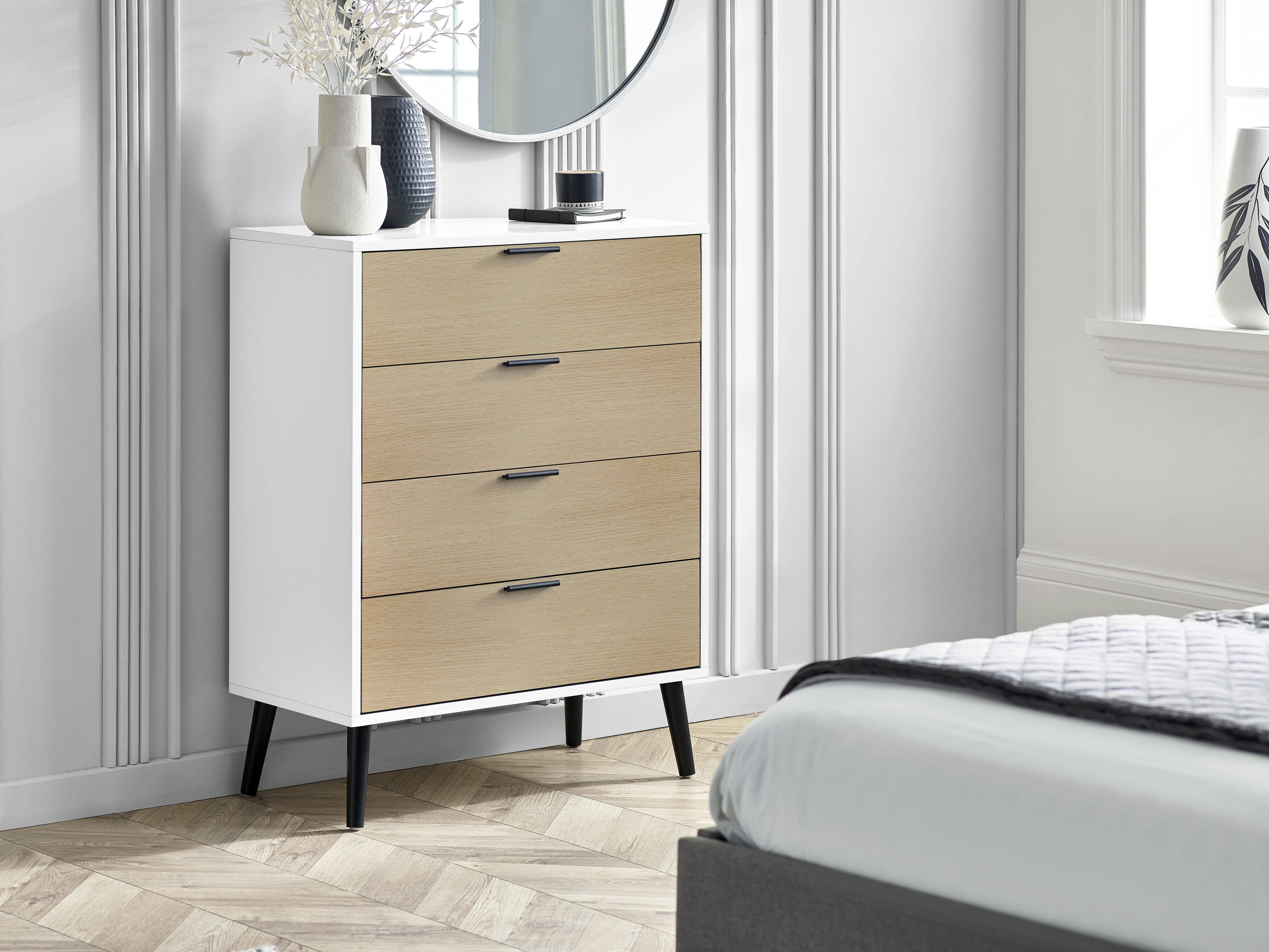 Dresser with three drawers in a bedroom setting