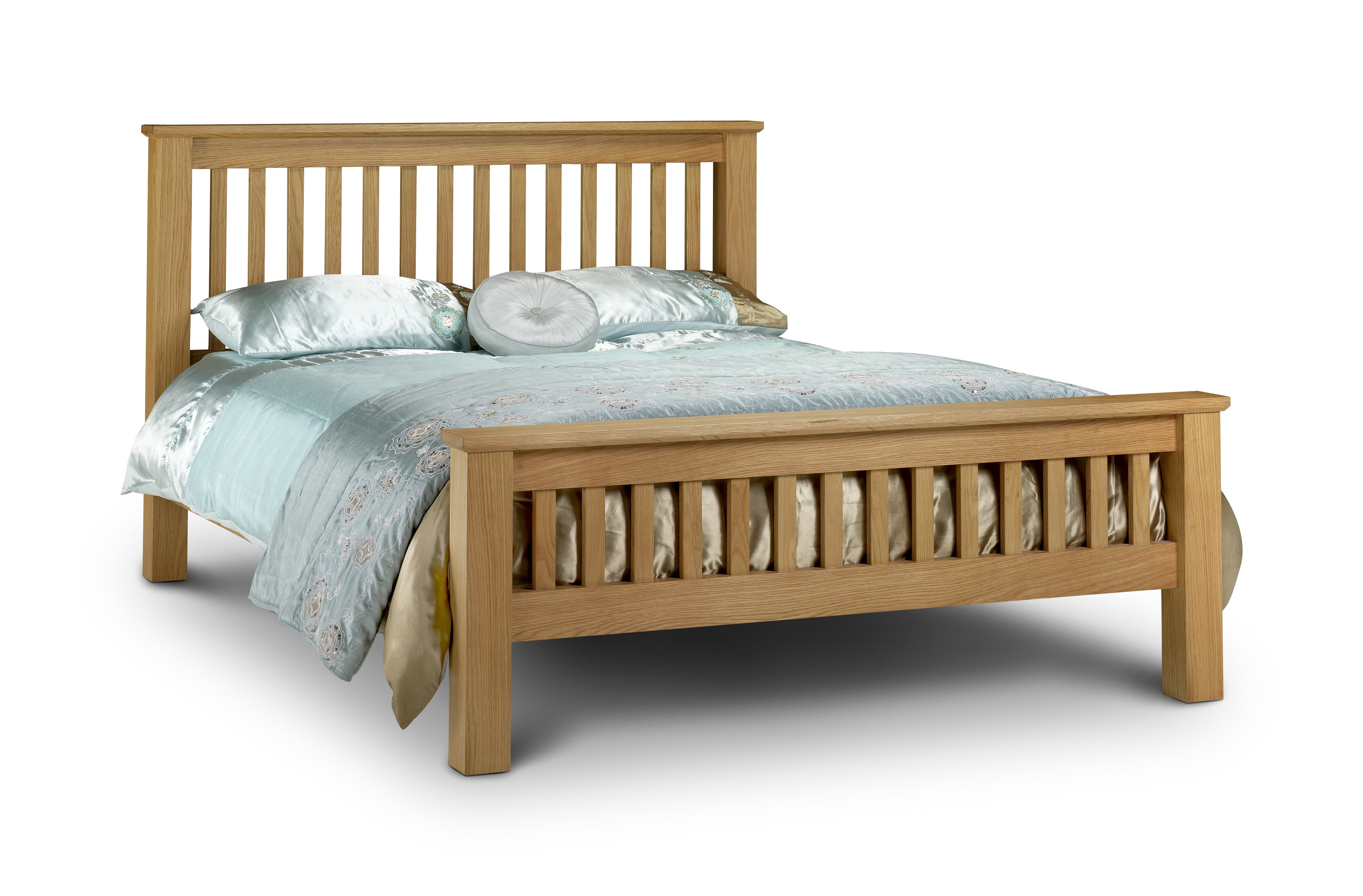 Wooden bed with light blue bedding on a white background