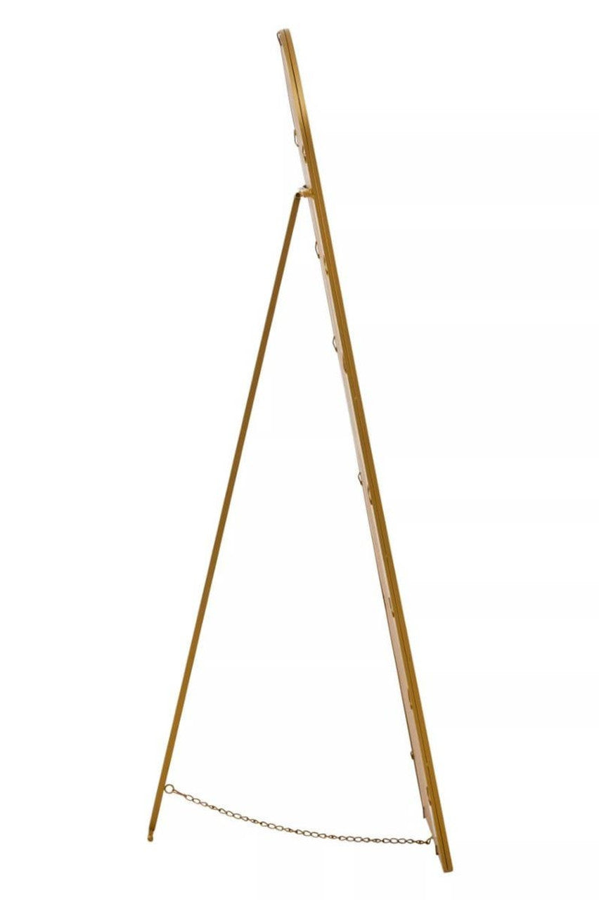 Side view of gold framed mirror on a white background