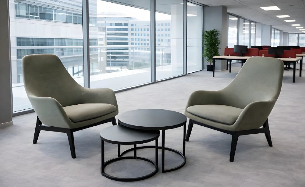 Modern office chairs and tables in a bright, open-plan office setting.