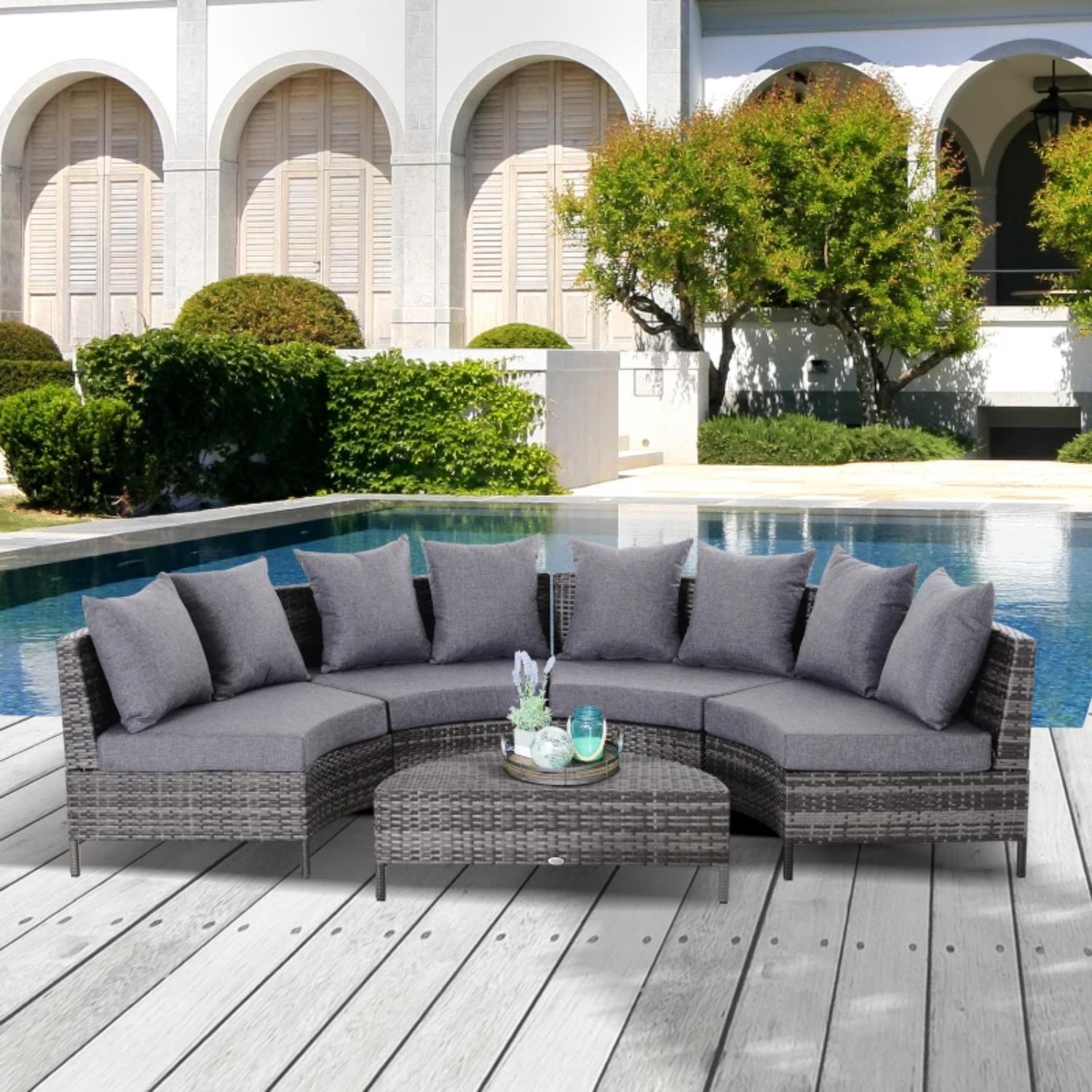 Outdoor patio sectional with gray cushions by a poolside.
