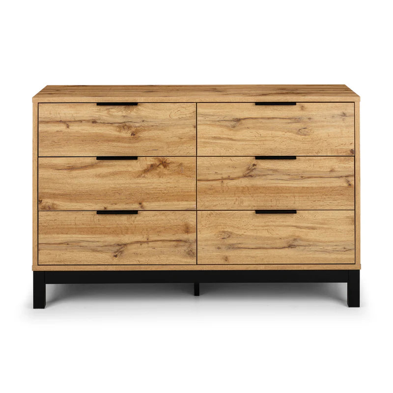 Wooden dresser with six drawers on a white background