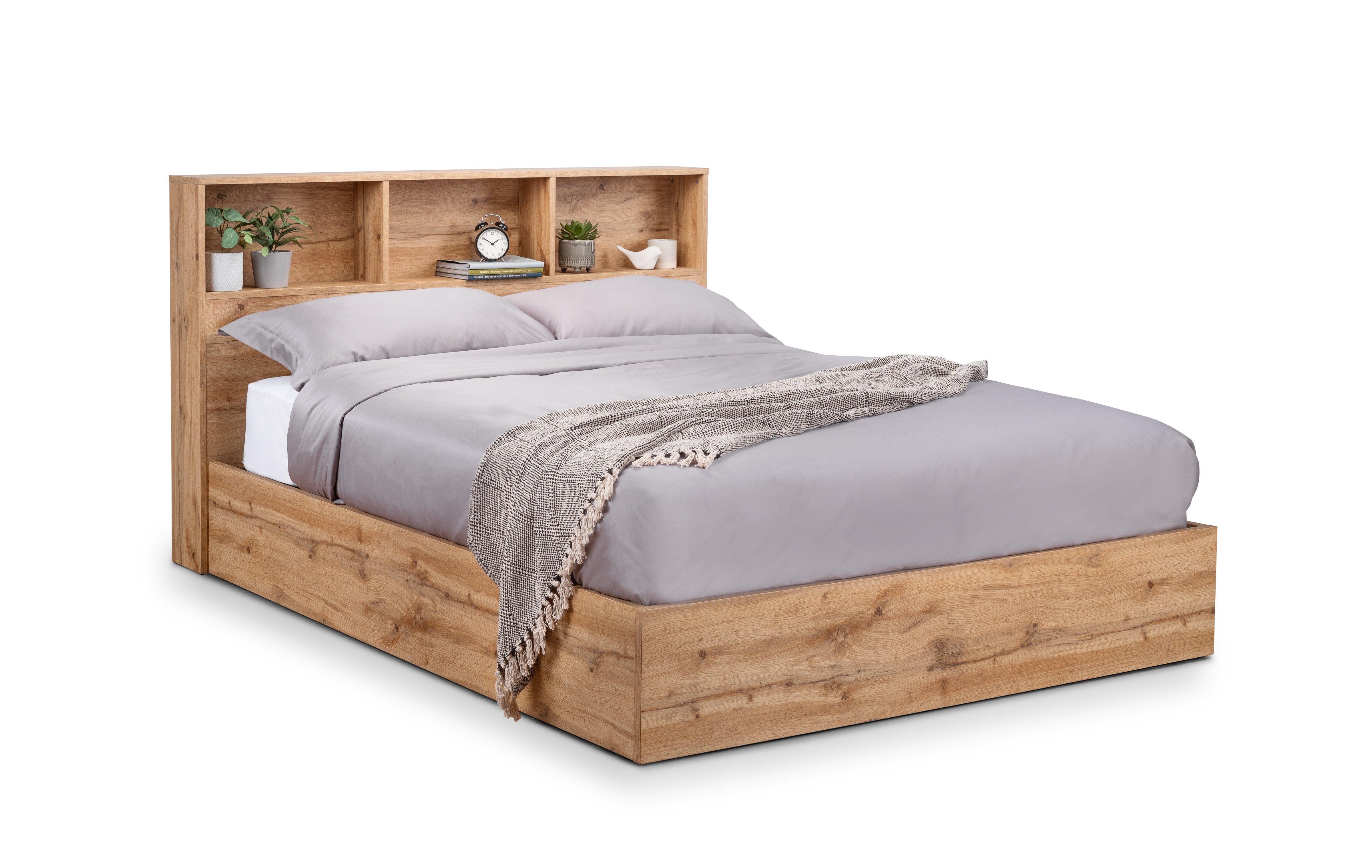 Wooden bed with bookshelf headboard on a white background
