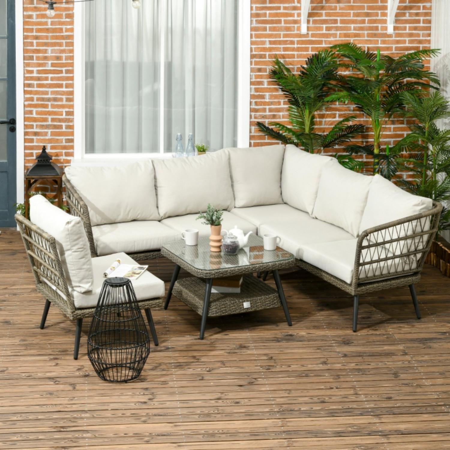Outdoor patio set with sectional sofa, chairs, and coffee table on a wooden deck.