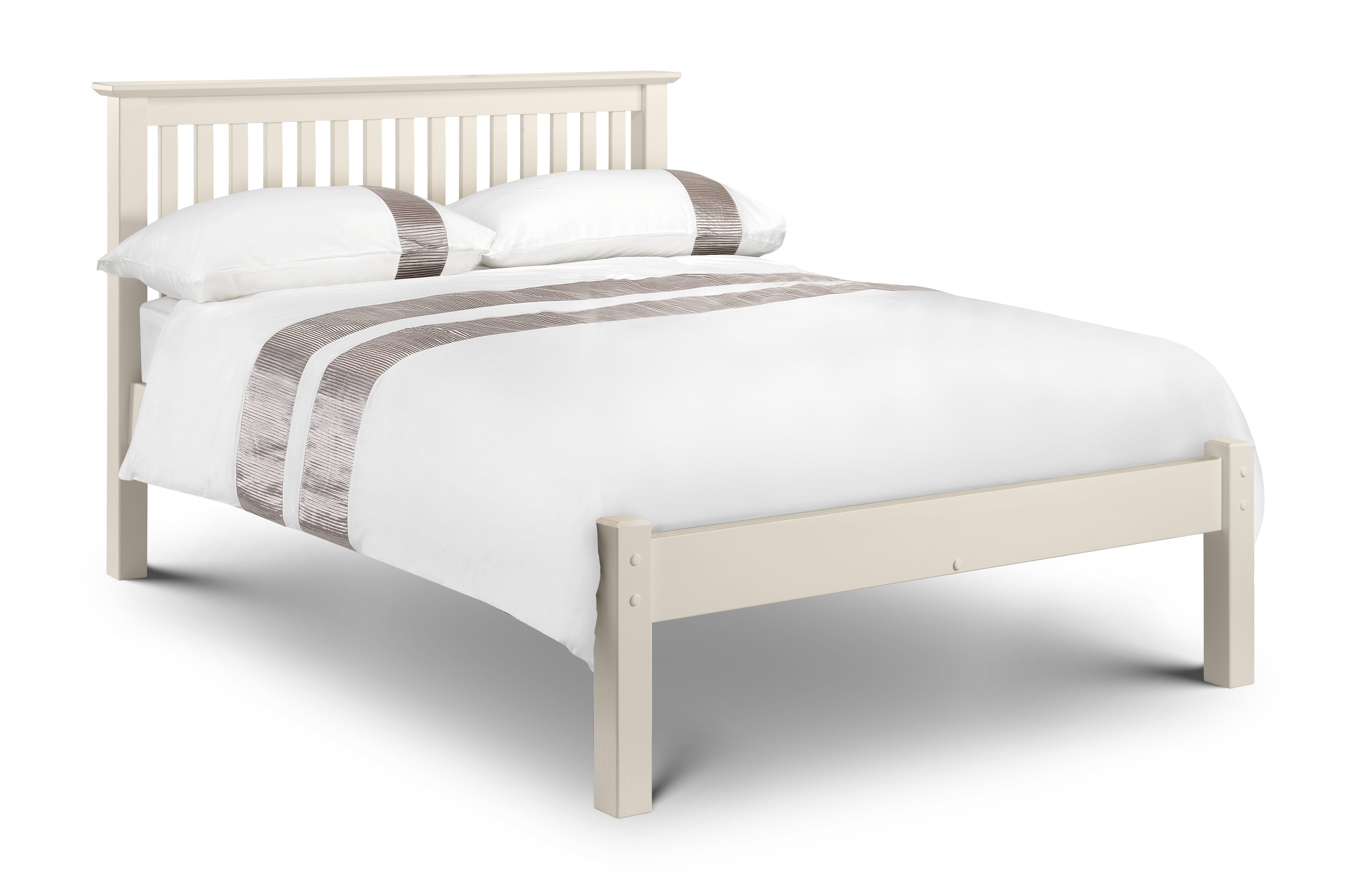 White wooden bed with white bedding and striped gray and white pillows on a white background