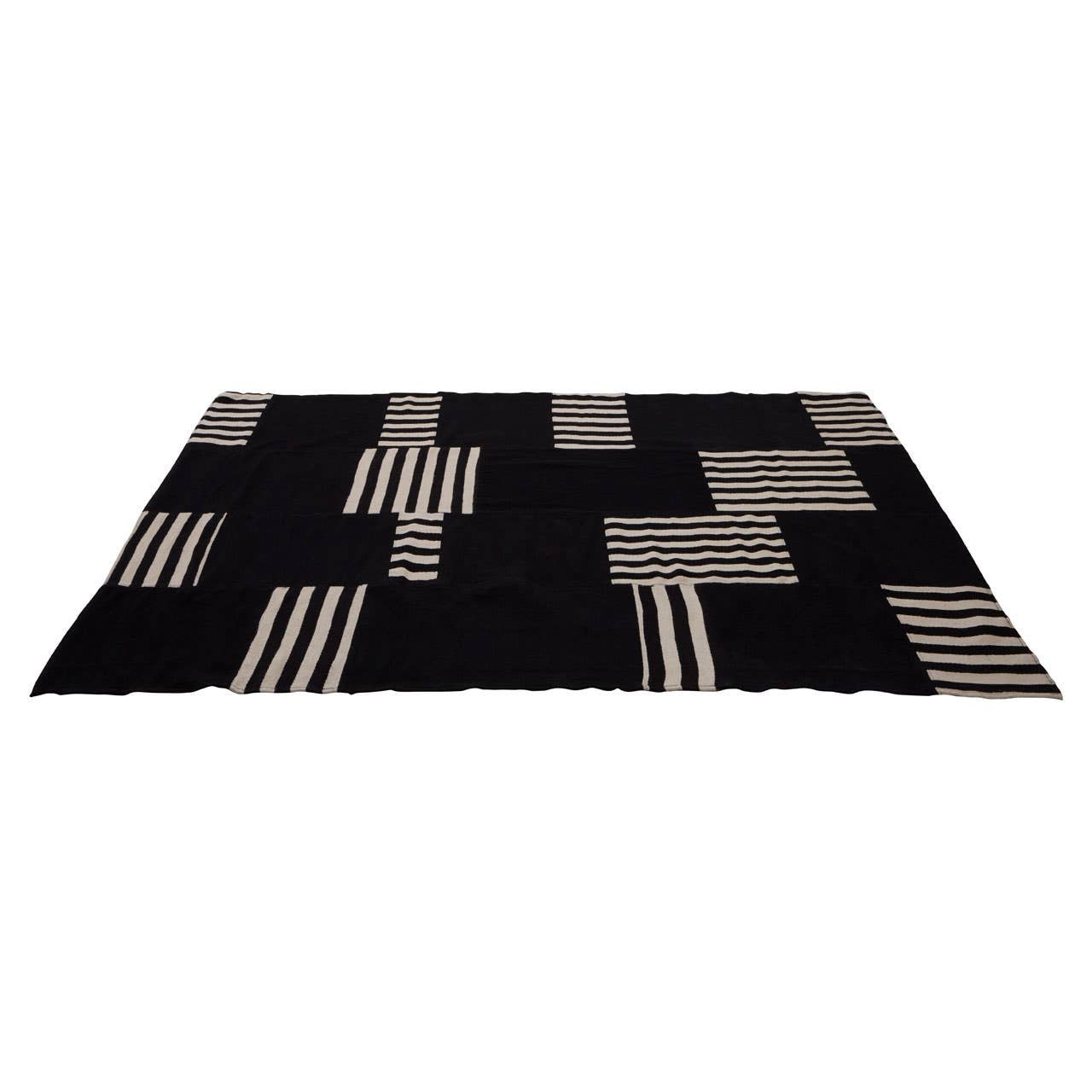 Black and white patterned rug on a white background