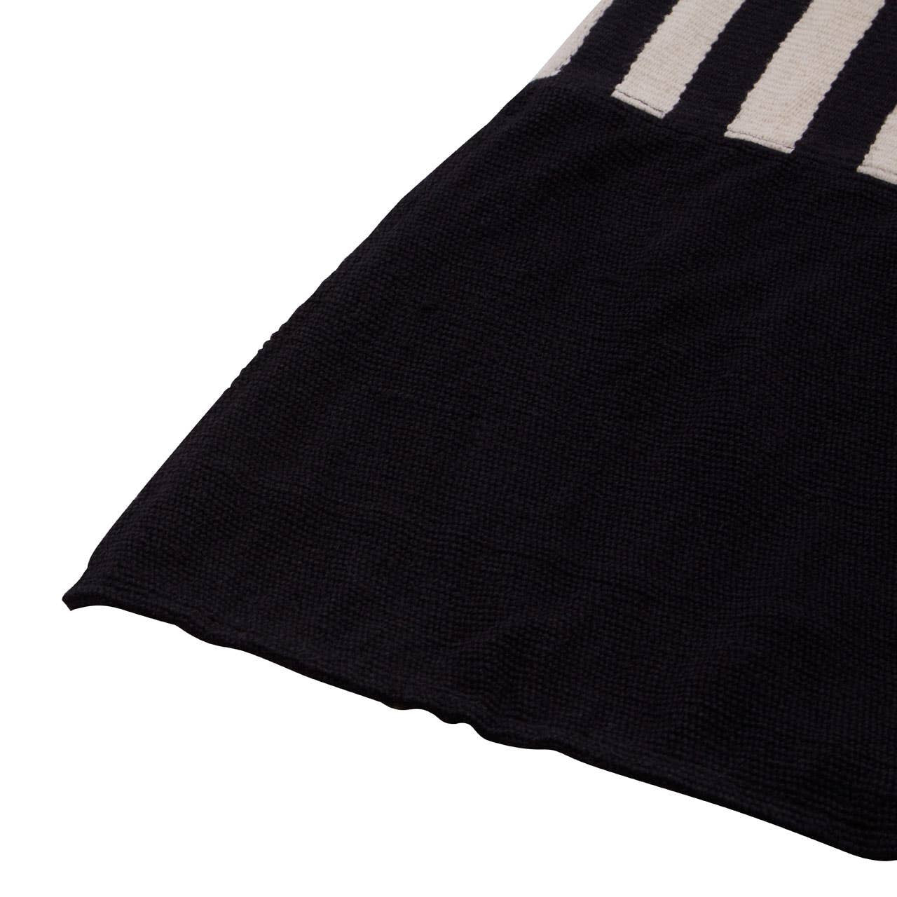 Black and white striped fabric on a white background