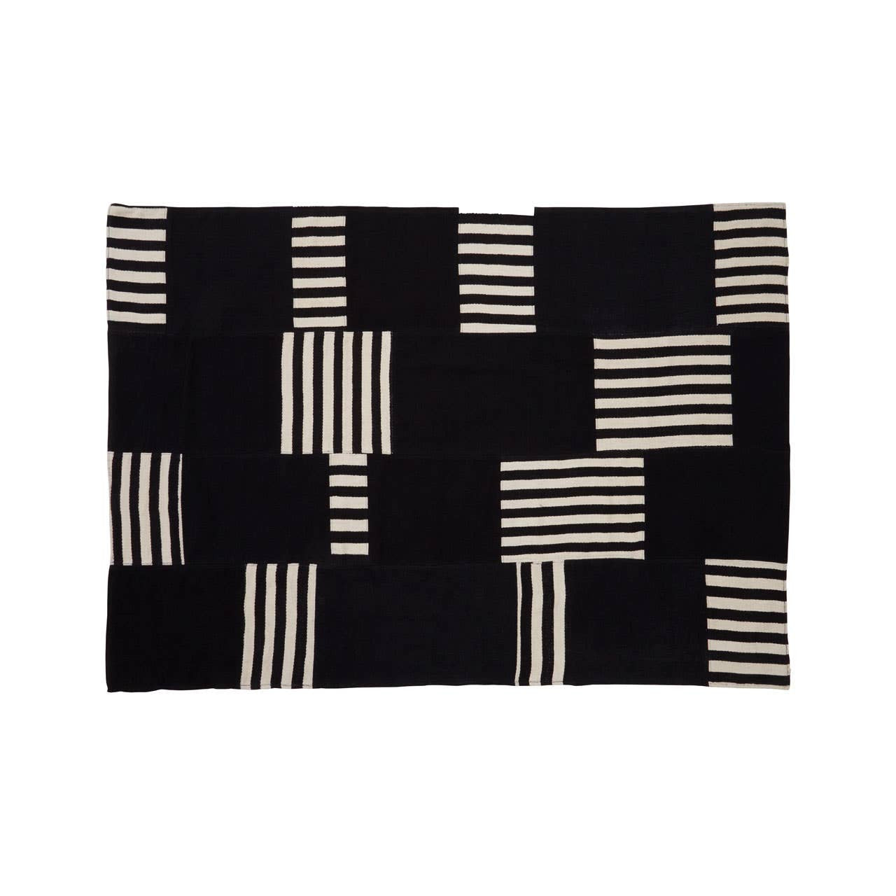 Black and white patterned rug with geometric design on a white background
