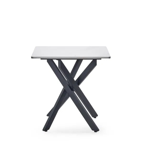 Small table with white top and black metal legs on a white background
