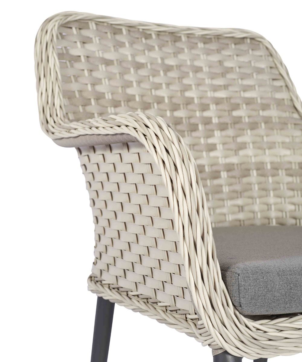 Woven chair with a neutral color palette on a white background