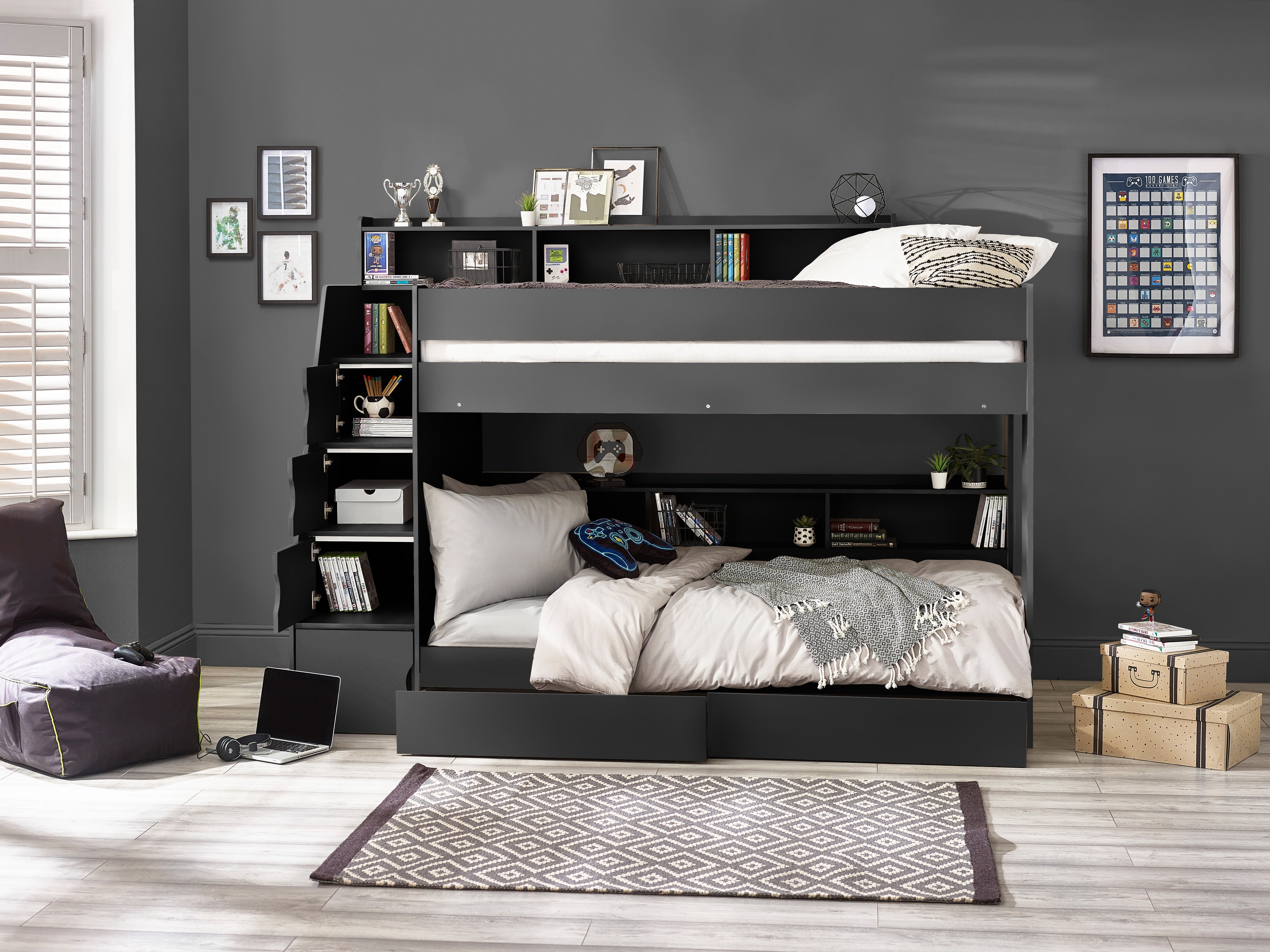 Bunk bed in a room with shelves and decor