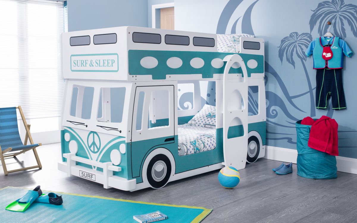 Children's room with a bus-shaped bed and surfboard decor.