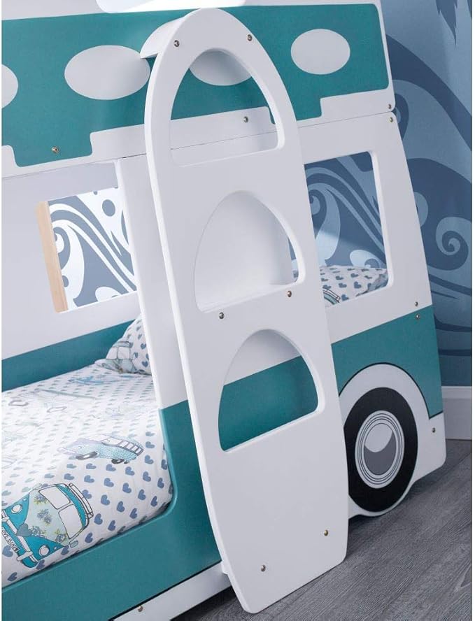 Children's bed designed like a campervan with a surf board shaped ladder, set against a blue and white patterned wall.