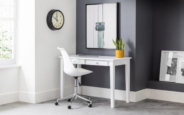 White desk with chair in a room with gray walls, a clock, and a plant.