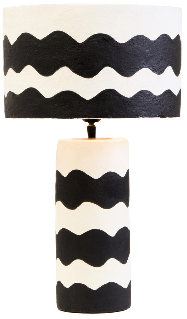 Table lamp with black and white wavy pattern on a white background