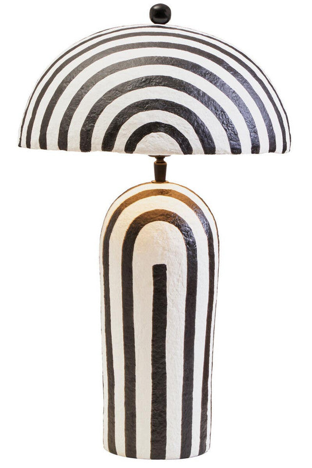 Table lamp with black and white striped design on a white background