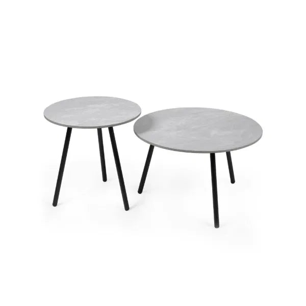 Two round side tables with grey tops and black legs on a white background