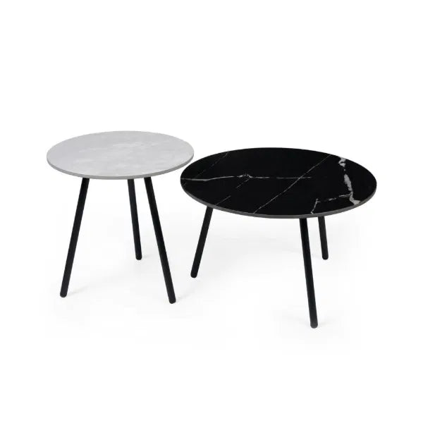 Two marble-top side tables, one with a white top and black legs, the other with a black top and black legs, on a white background.