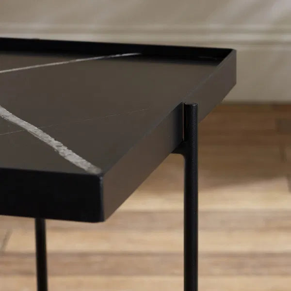 Close-up of a black marble table with a blurred background