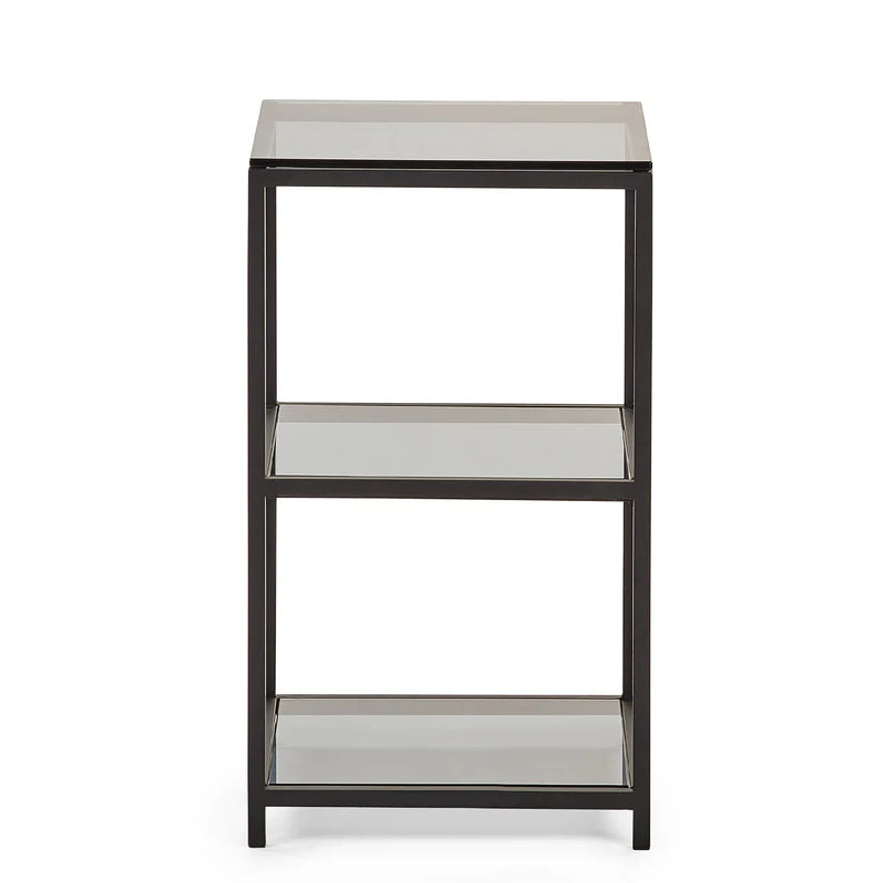 Three-tiered metal side table with glass shelves on a white background