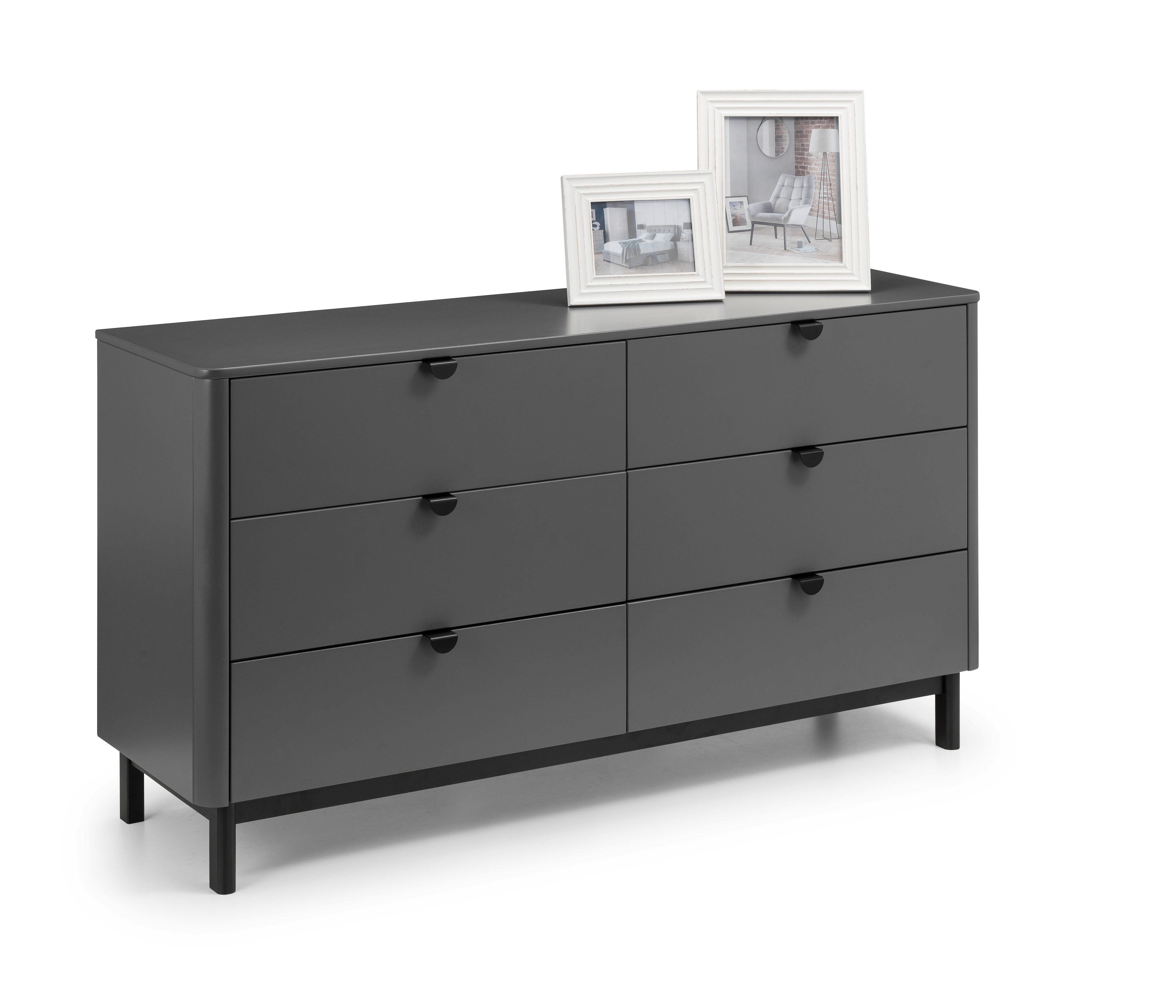 Gray dresser with four drawers on a white background