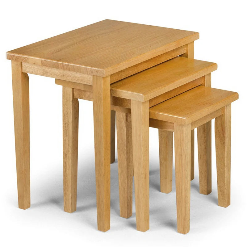 Set of three wooden nesting tables on a white background