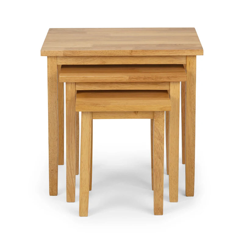 Set of three wooden nesting tables on a white background