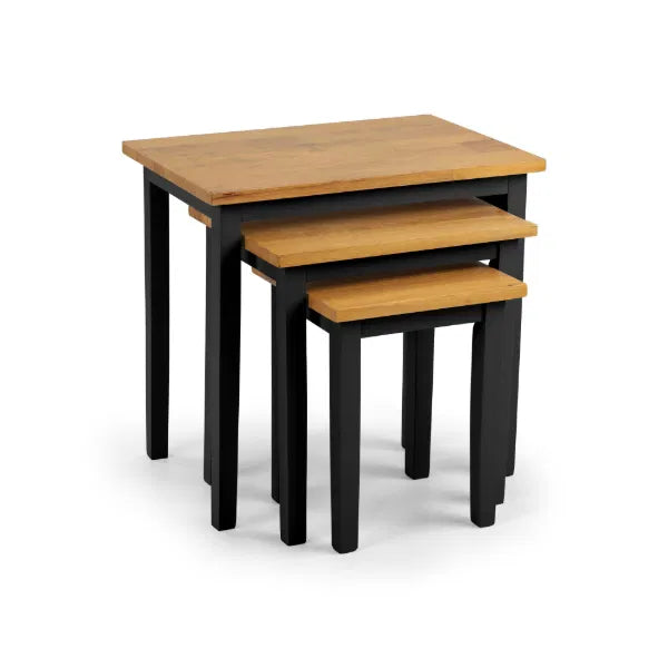 Set of three nesting tables with wooden tops and black legs on a white background