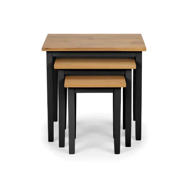 Set of three nesting tables with wooden tops and black bases on a white background