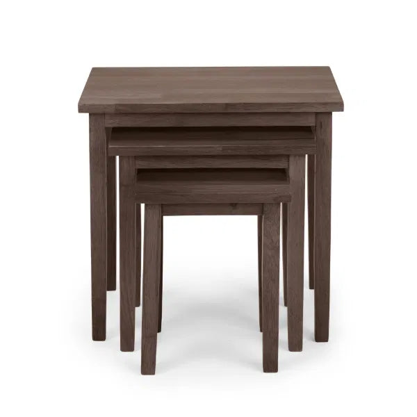 Set of three wooden nesting tables on a white background