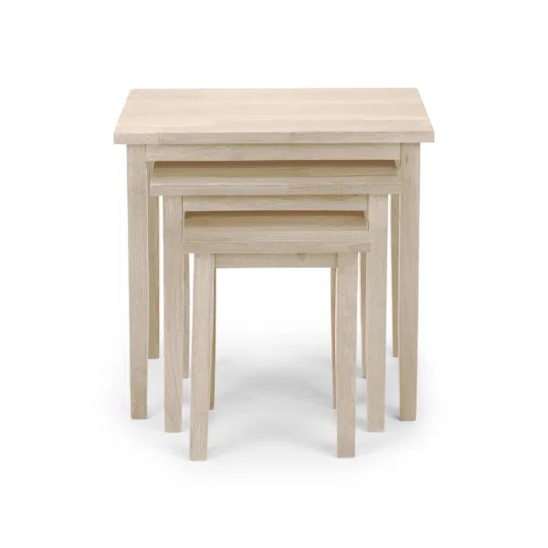 Set of three wooden nesting tables on a white background