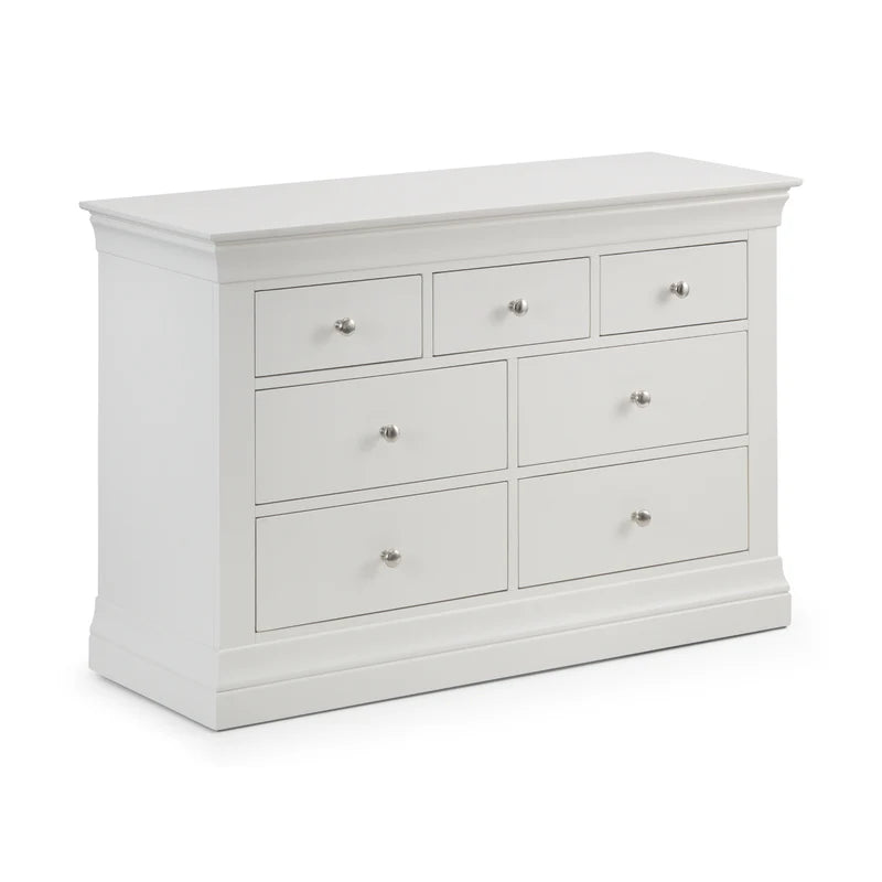 White dresser with multiple drawers on a white background