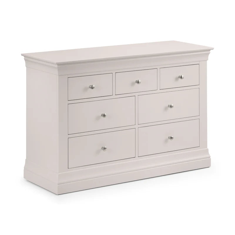 White dresser with multiple drawers on a white background