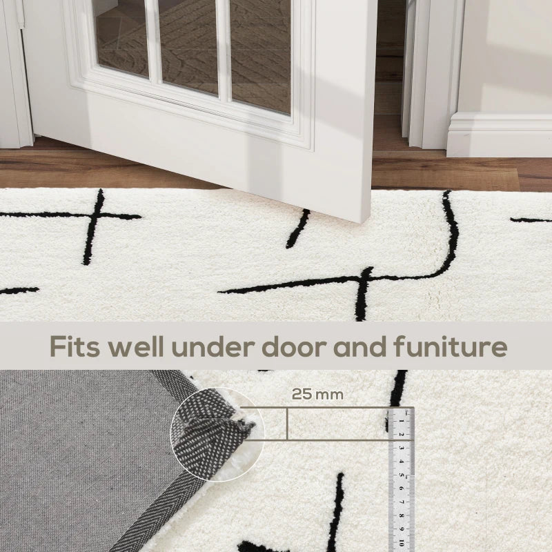 White rug with black geometric patterns on a wooden floor, showing how it fits under furniture.