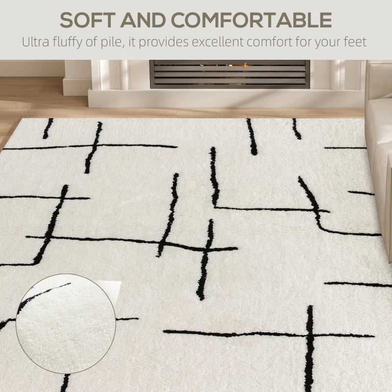White rug with black abstract patterns in a room setting, highlighting comfort and softness.