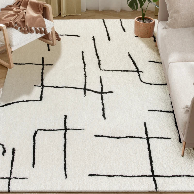 White rug with black abstract pattern in a living room setting