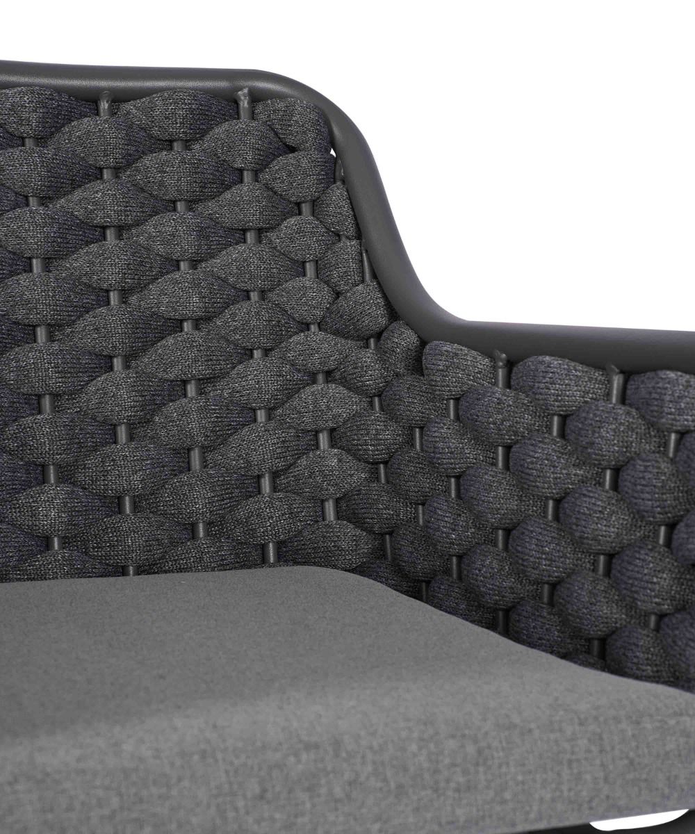 Gray wicker chair with a textured backrest on a white background