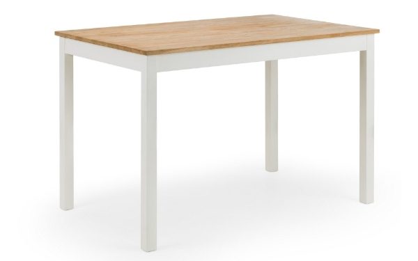 Dining table with wooden top and white legs on a white background