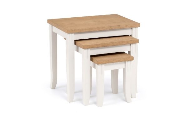 Set of three wooden nesting tables with white base on a white background