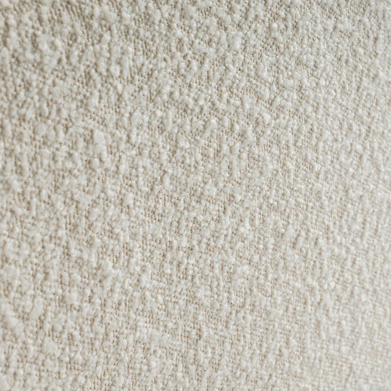 Close-up of a textured beige fabric surface