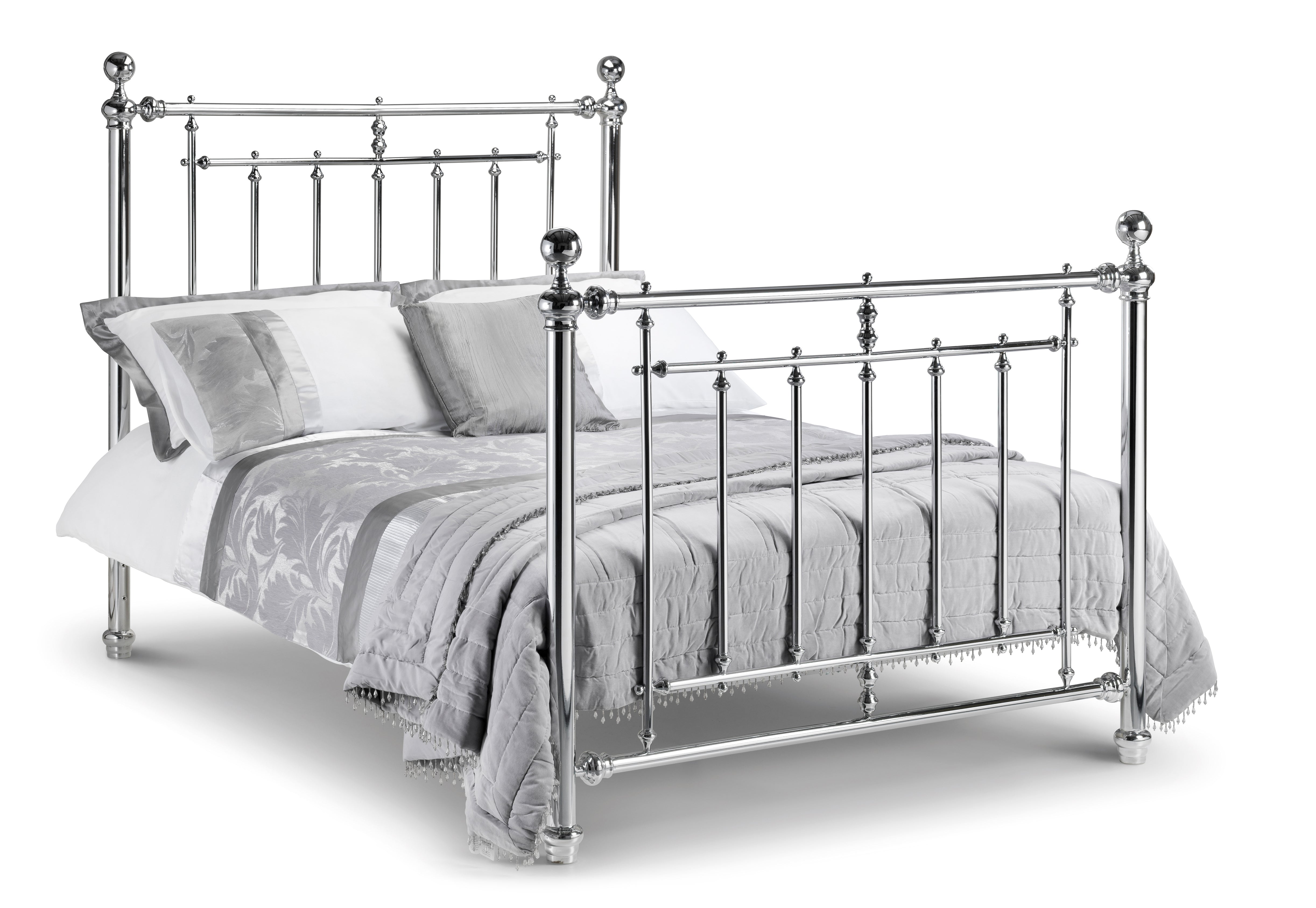 Metal bed with bedding on a white background