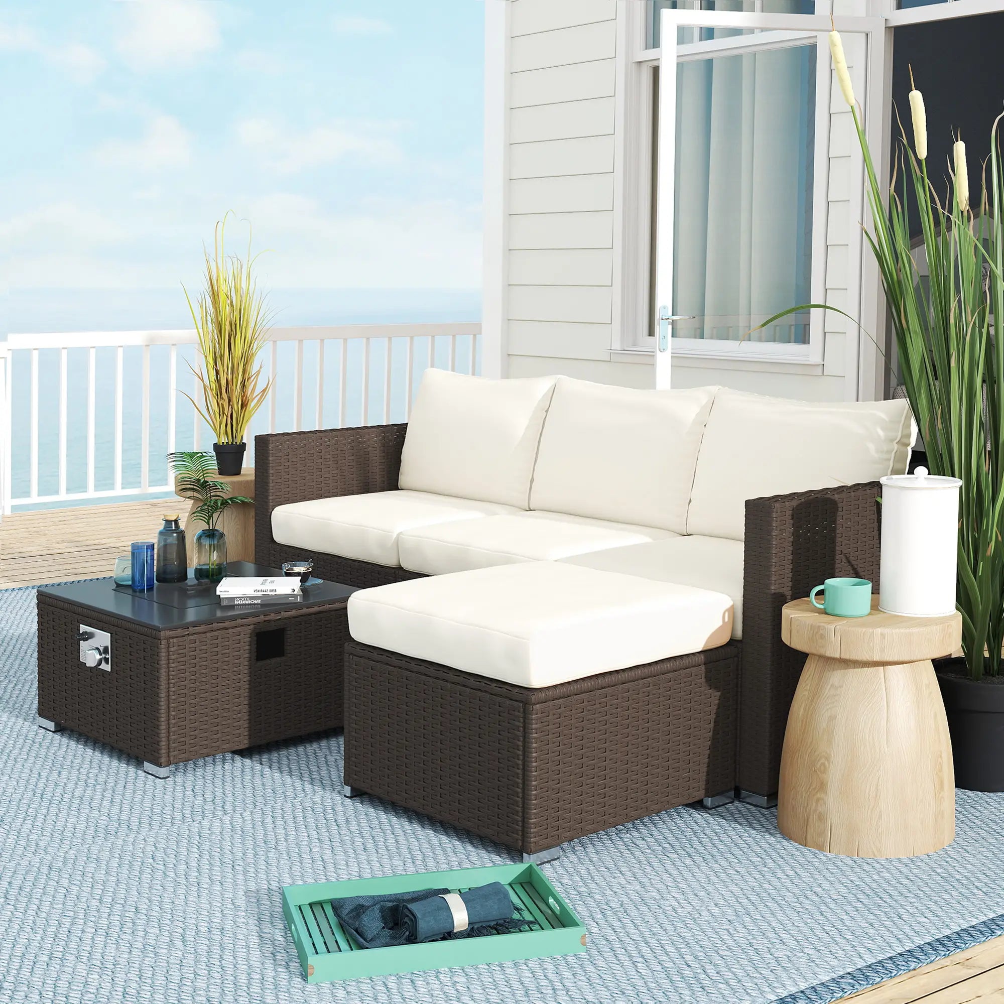 Fiji rattan fire pit set with modular seating, cushions and coffee table on a deck