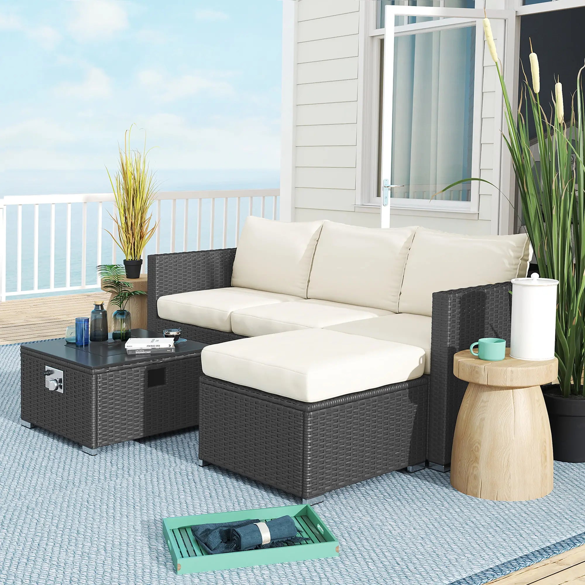Outdoor patio furniture set with a sectional sofa, coffee table, and side table on a deck.